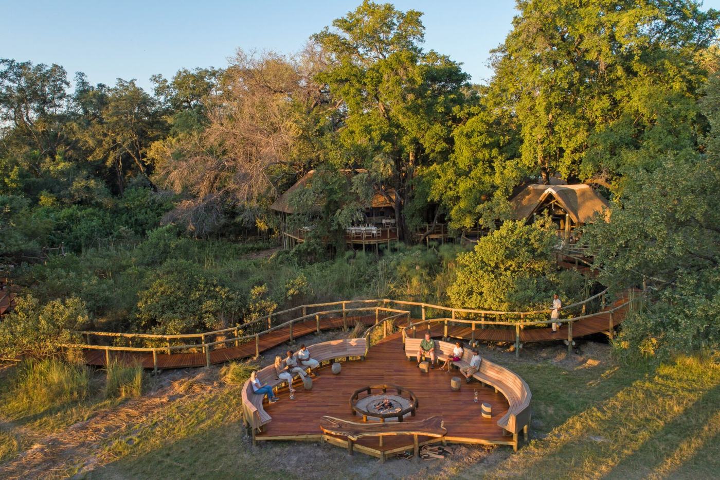 Camp Moremi from the air, a round fire deck below thatched buildings in Moremi Game Reserve