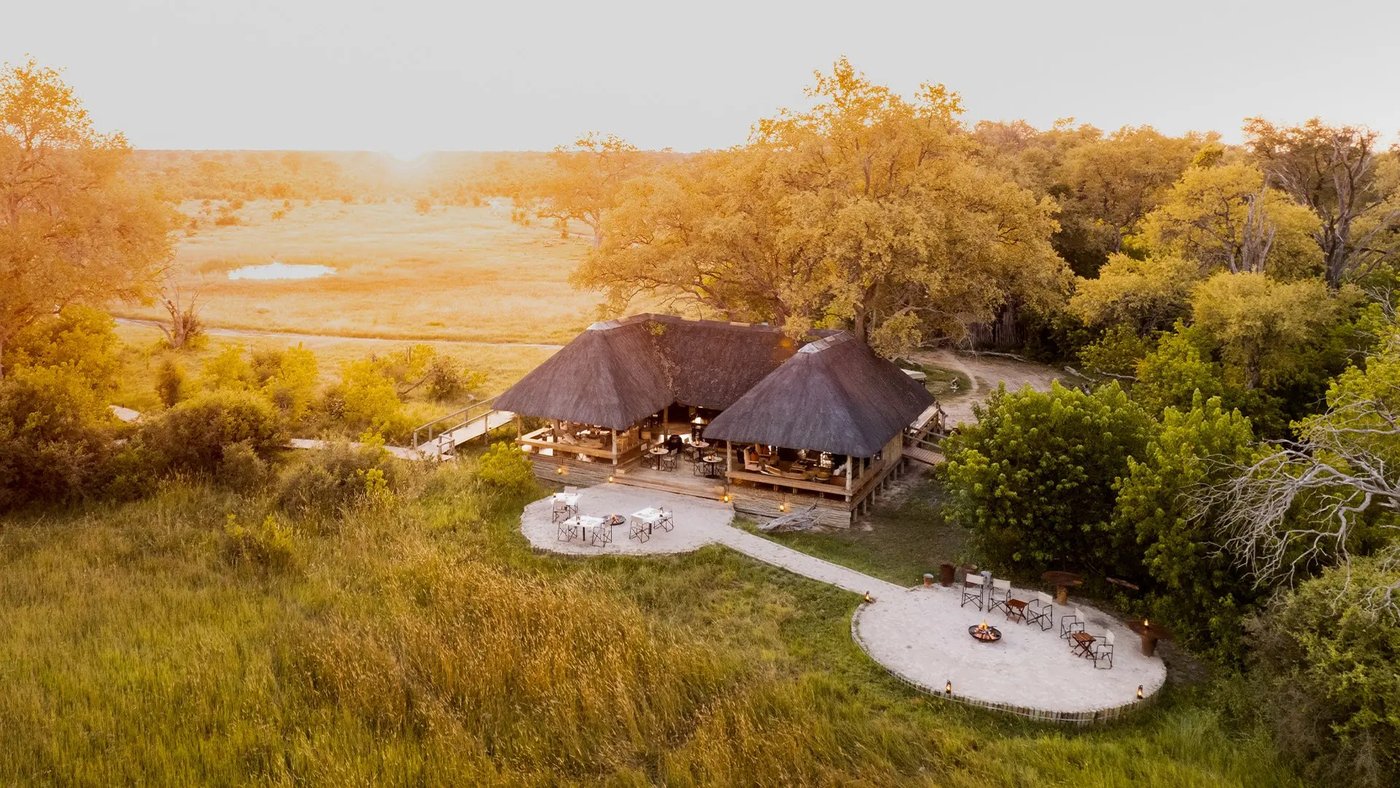 Little Sable's thatched main area and fire deck from the air, in the reserve beside Moremi