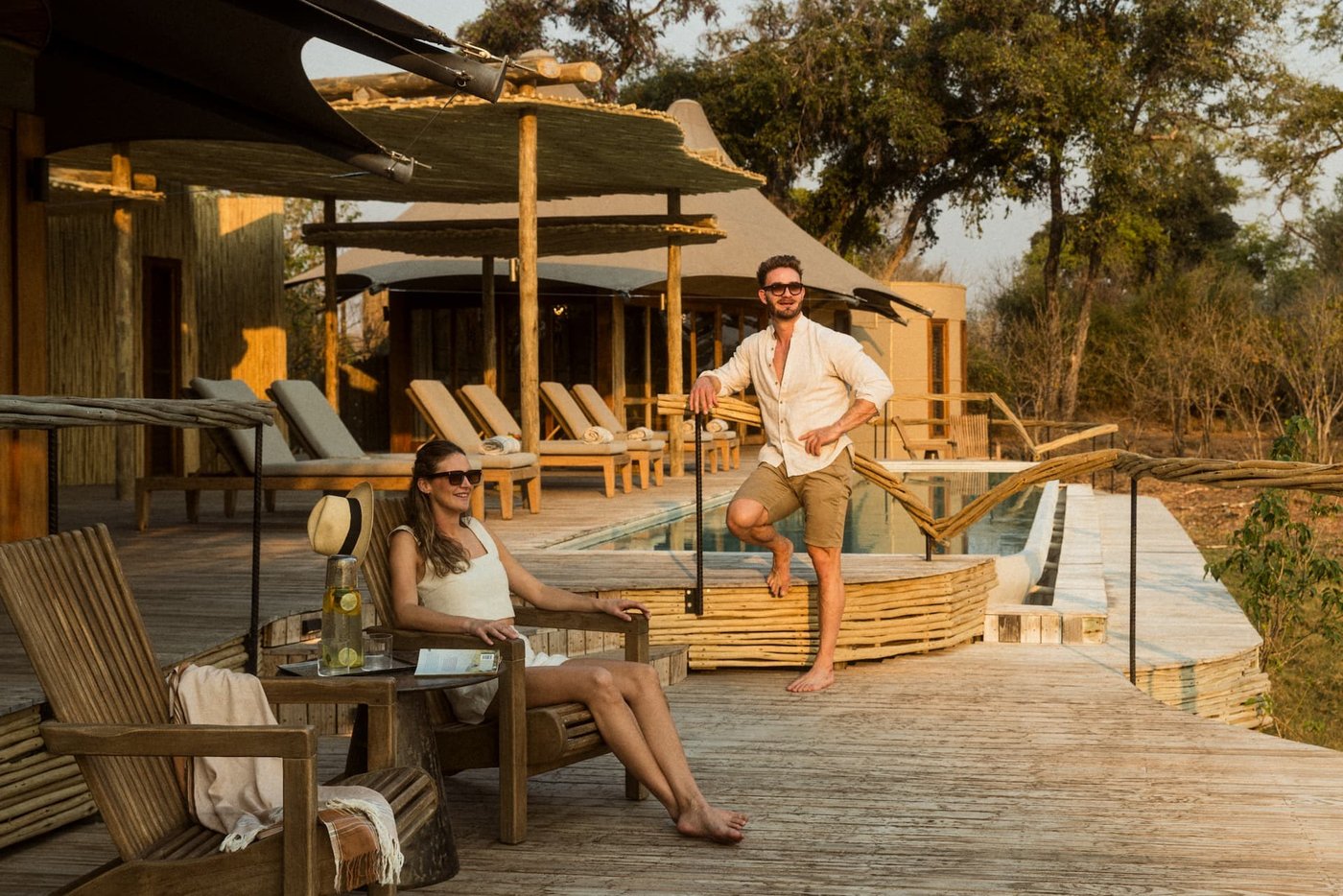 Sunset on the pool deck and tented suite at Mombo Camp