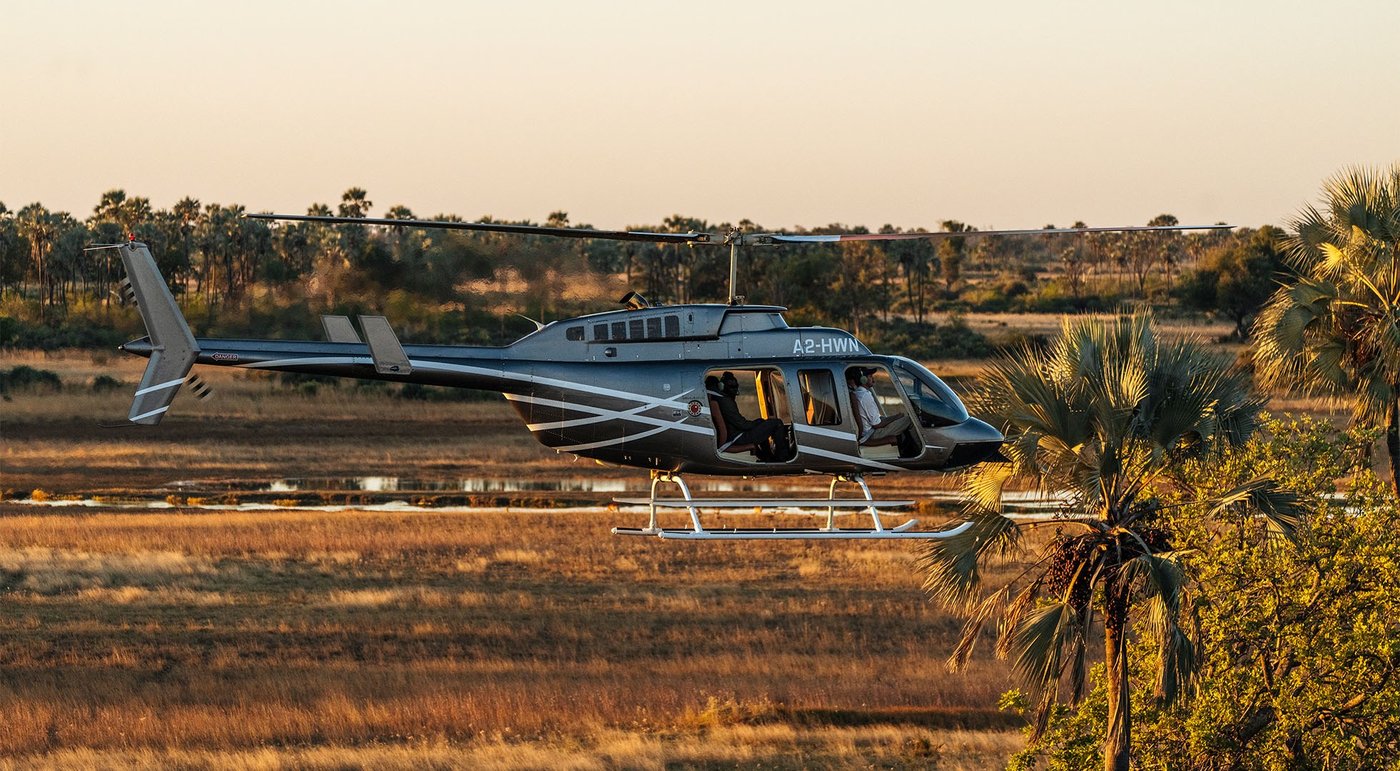A scenic helicopter flight taking off over the floodplain near Sango Safari Camp
