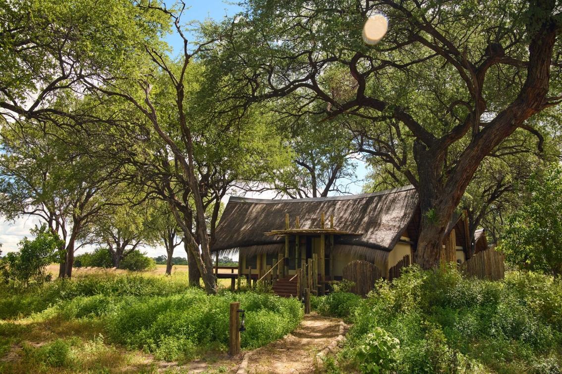 Thatched suite tucked among trees on the path to Sediba Sa Rona