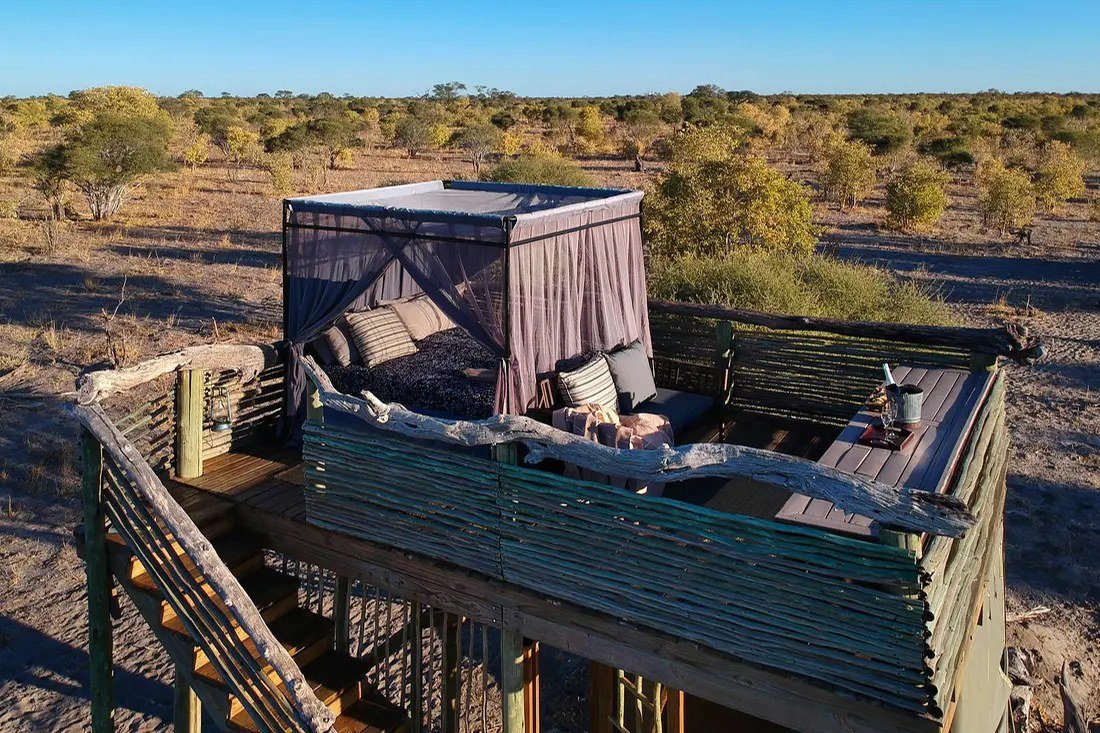 Looking down on the open-air bed and deck at the top of a Skybeds tower