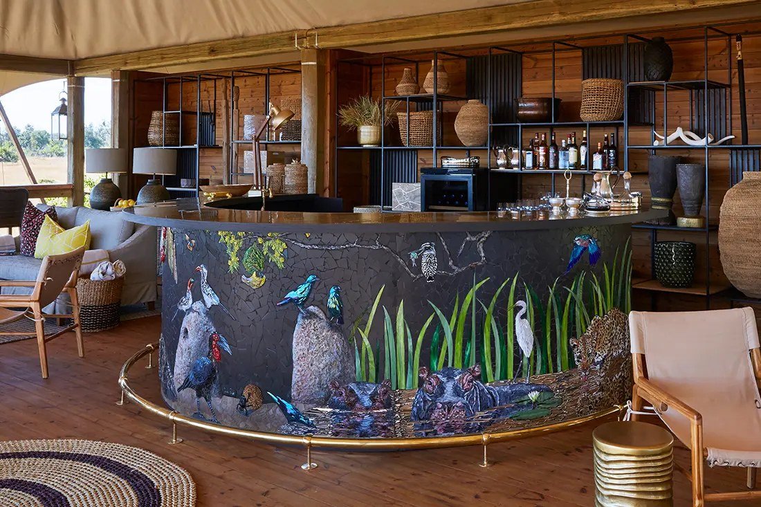 Round bar at Tuludi with a mosaic of hippos, egrets and a leopard